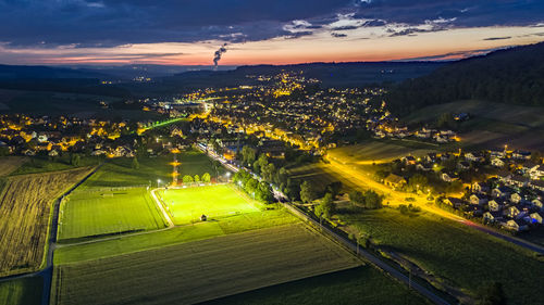 High angle view of field against sky during sunset