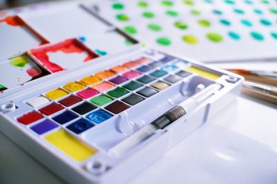 High angle view of watercolor paints on table