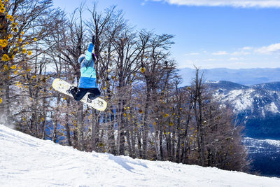 Man jumping in snow