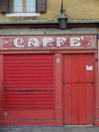 Red text on brick wall