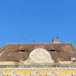 Low angle view of building against clear blue sky