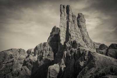 Low angle view of rock formations against sky during sunset