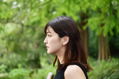 Portrait of a young woman looking away