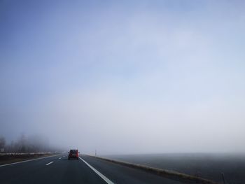 Car on country road against sky