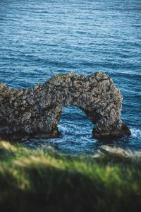 High angle view of rocks on sea