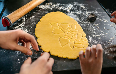 Cropped hand of person holding cake