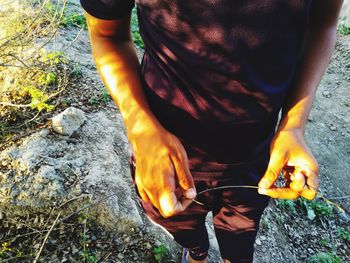Low section of man standing outdoors