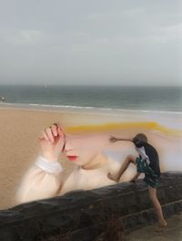 Woman standing on beach