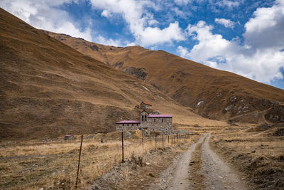 Scenic view of landscape and mountains against sky