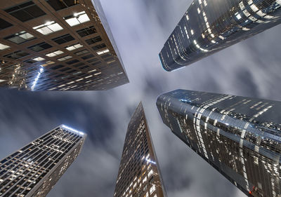 Looking up at skyscrapers in downtown los angeles at night