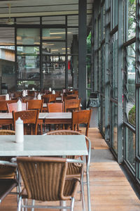 Empty chairs and tables in cafe