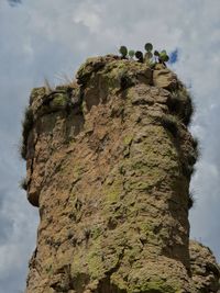 Low angle view of rock against sky