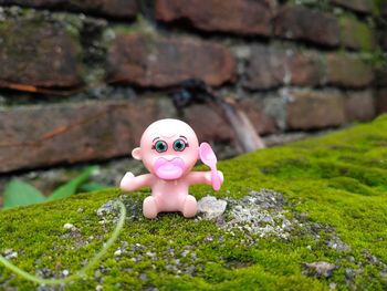 Close-up of stuffed toy on field