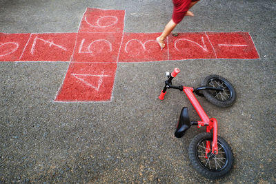 Chalk game for kids and a child who jumps