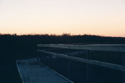 Scenic view of dam against sky during sunset