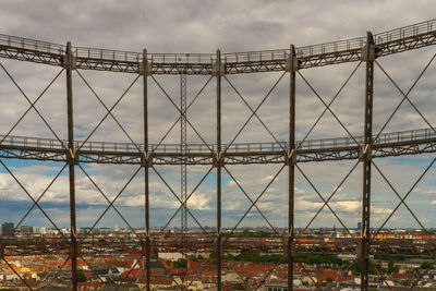 View of suspension bridge against cloudy sky