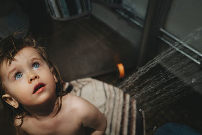 High angle portrait of girl looking at home