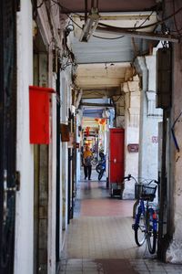 Man cycling in corridor