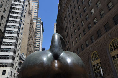 Low angle view of statue against sky