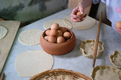 Midsection of chef preparing food at table in kitchen