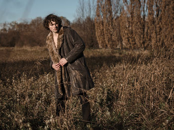 Full length of man standing on field