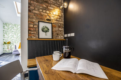 Open book on table at home