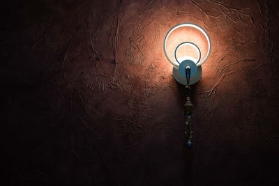 Low angle view of illuminated light bulb