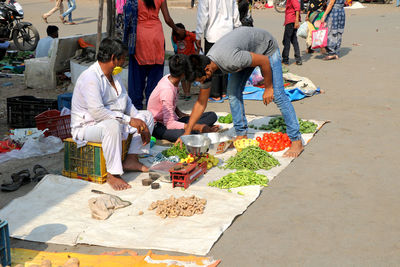 Group of people at market stall