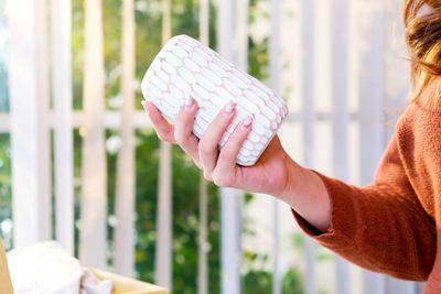 Midsection of woman holding ice cream