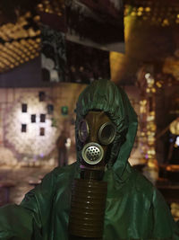 Portrait of person wearing gas mask