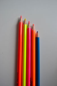 Close-up of colored pencils against white background