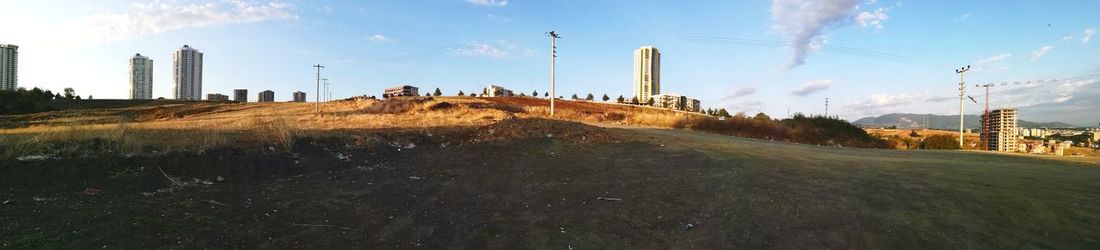 Panoramic view of factory against sky