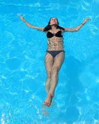 Full length of woman in swimming pool