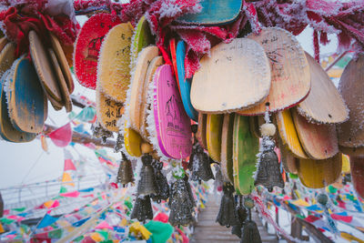 Close-up of multi colored hanging for sale in market