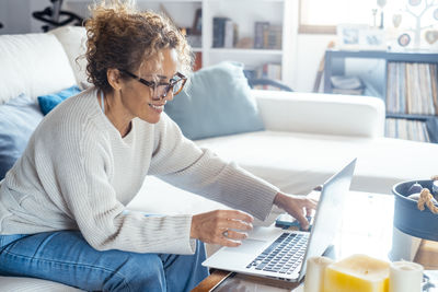 Young man using laptop at home