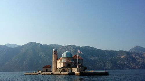 Scenic view of sea with mountains in background
