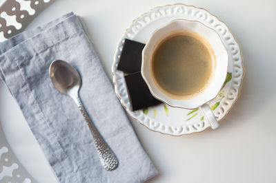 High angle view of coffee cup on table