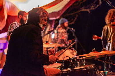 People playing at music concert