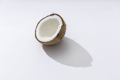 High angle view of broken glass on white background