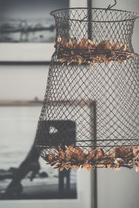 Close-up of rusty chain by sea against sky