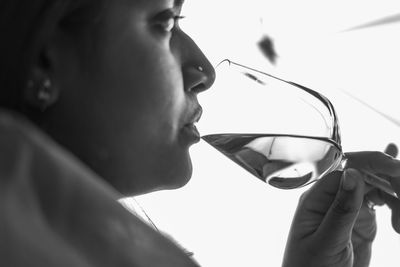 Close-up of woman drinking wine