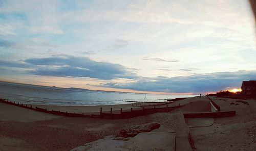 Scenic view of sea against cloudy sky