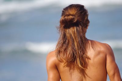 Close-up of young woman looking away