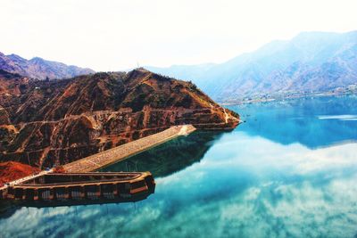 Scenic view of lake and mountains against sky