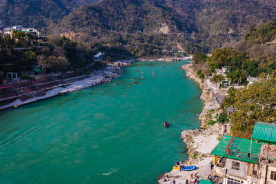 Raft boat many at the middle of ganges river from top angle