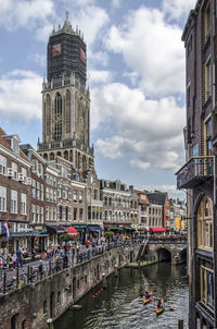 View of buildings against cloudy sky