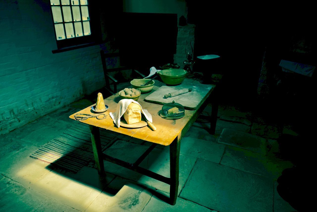 HIGH ANGLE VIEW OF TABLE AND CHAIRS ON WINDOW