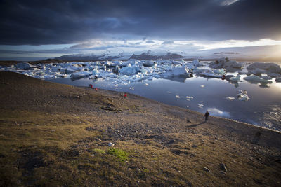 Scenic view of landscape against sky during winter