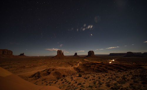 Scenic view of field against sky at night