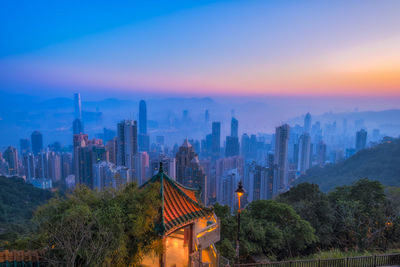 Victoria peak at sunrise time. skyscraper view from famous place of hong kong city